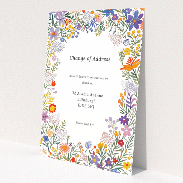 Floral change of address card with two photos and vibrant flower border