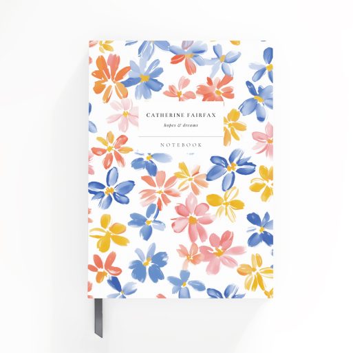 Colourful floral design on a personalised notebook cover spread from Utterly Printable with two photos.