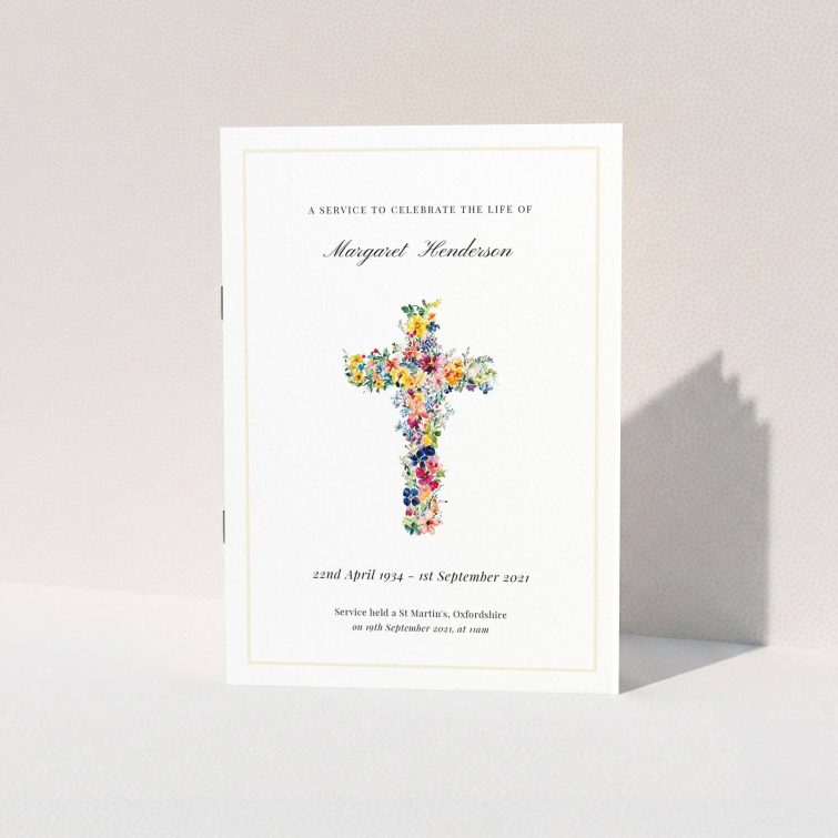 Floral cross design on funeral order of service programme cover with one photo placeholder.