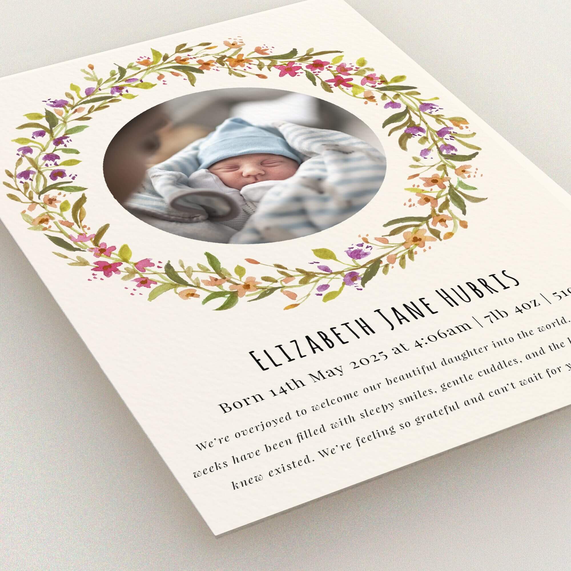 Floral birth announcement card design with one photo of a newborn baby in the centre.