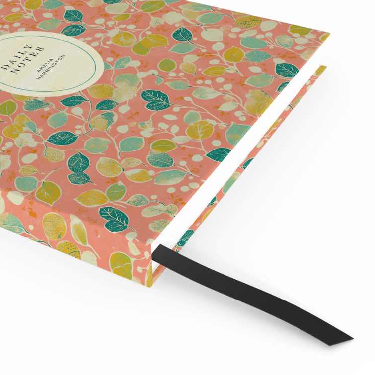 Colourful floral design for personalised notebooks cover with one photo placeholder on a peach background.