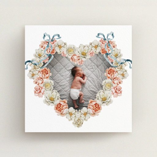 Heart-shaped floral birth announcement card design with one photo of a baby in the centre.