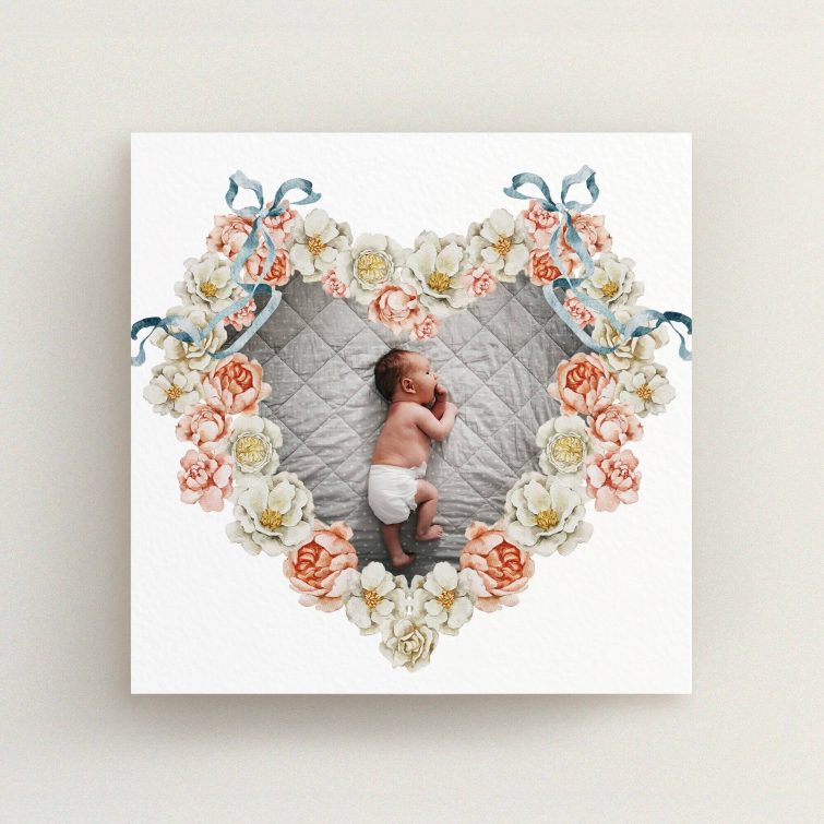 Heart-shaped floral birth announcement card design with one photo of a baby in the centre.