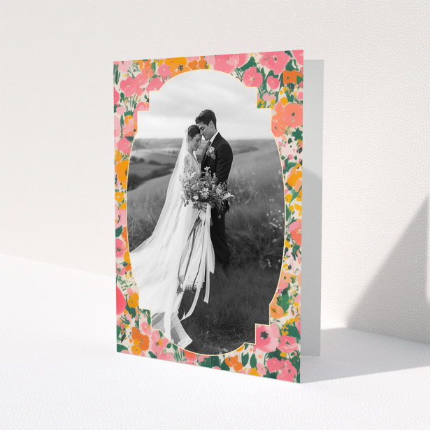 Wedding invitation card with floral border and one photo of a couple