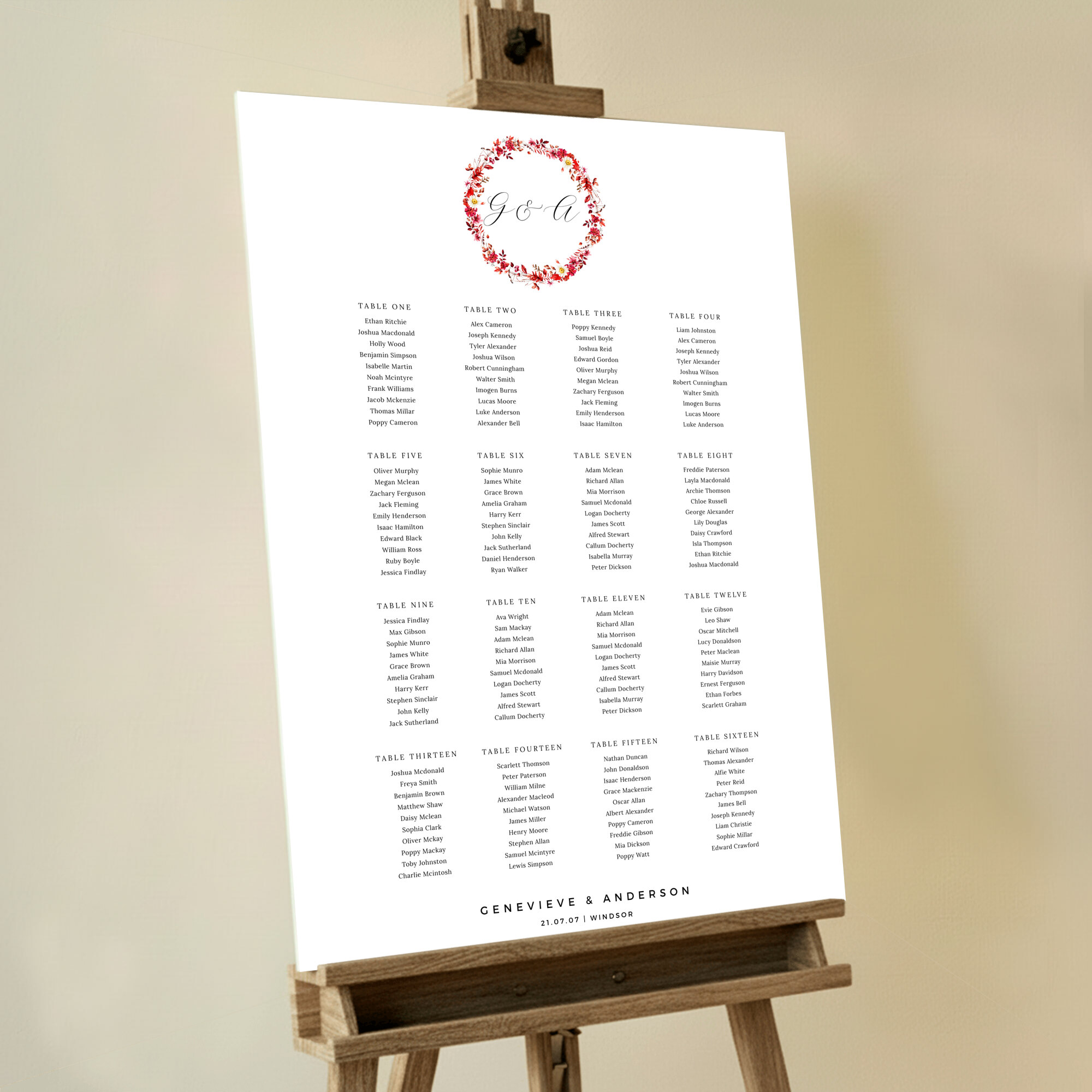 Personalised Floral Monogram Foamex Seating Plan featuring a red floral wreath adorned with yellow and white flowers, and the married couple's initials in a beautiful handwritten font, adding timeless elegance and personalisation to your sophisticated wedding seating arrangement.. This design shows 16 tables.