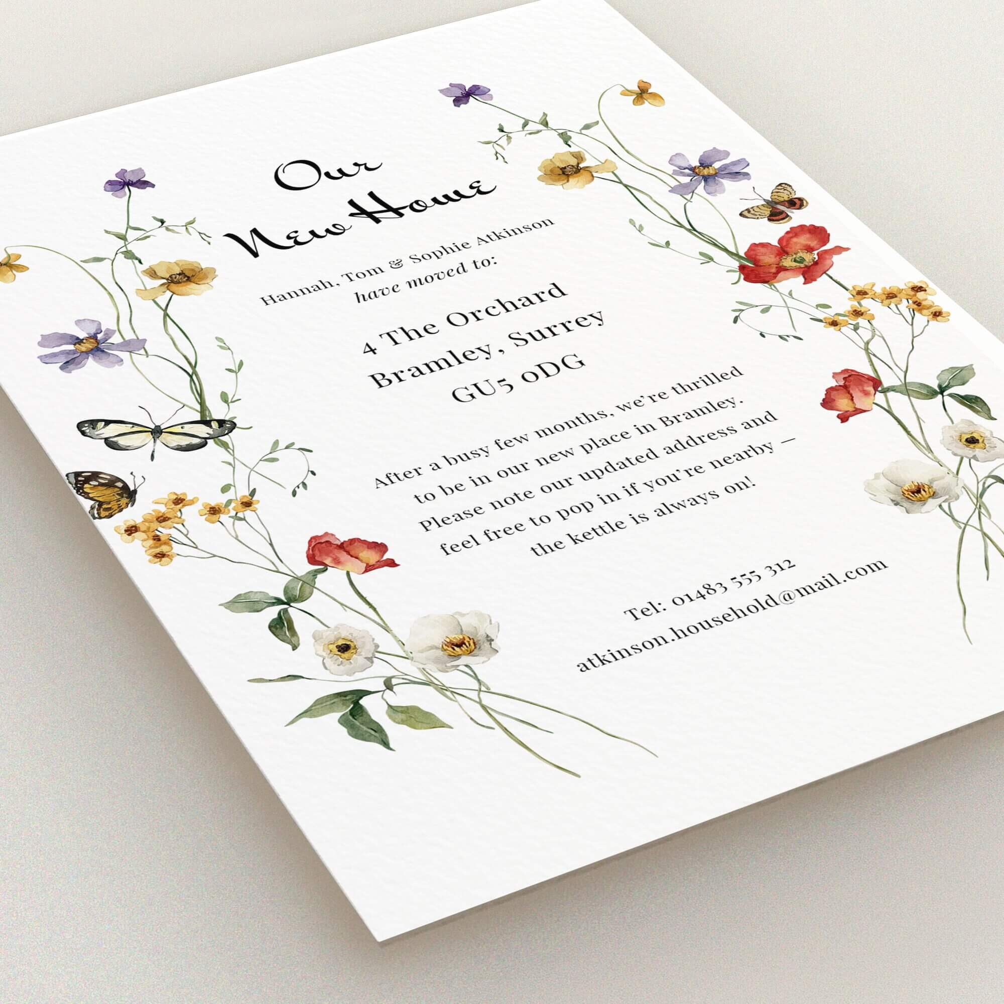 Floral change of address card design with two butterfly illustrations.