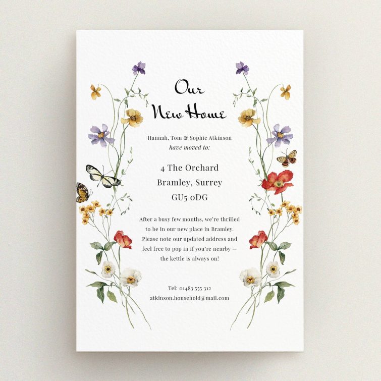 Floral change of address card design with two butterfly illustrations.