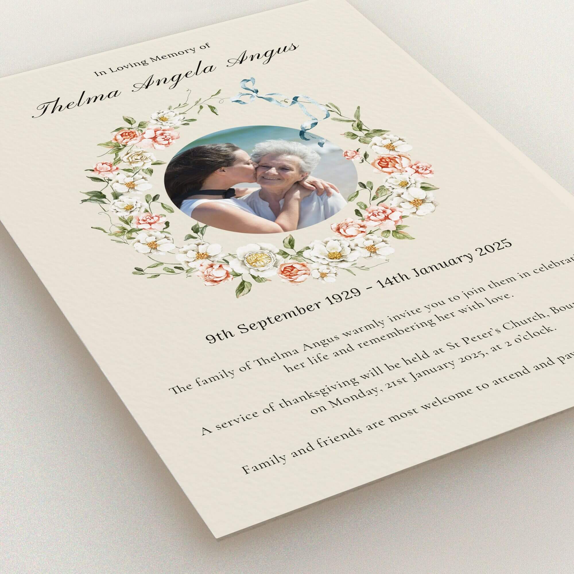 Floral funeral announcement with one photo of two people embracing