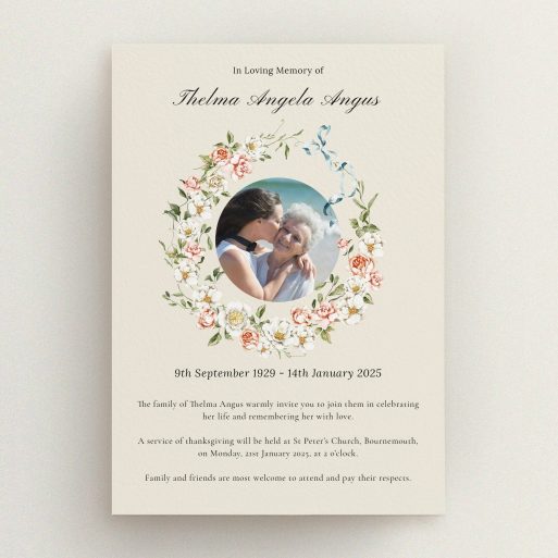 Floral funeral announcement with one photo of two people embracing