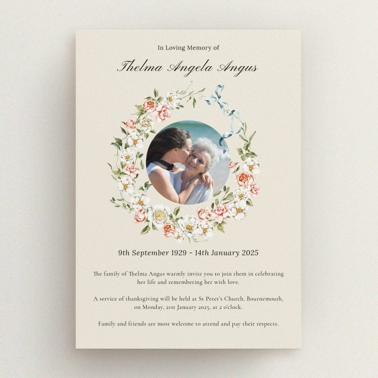 Floral funeral announcement with one photo of two people embracing
