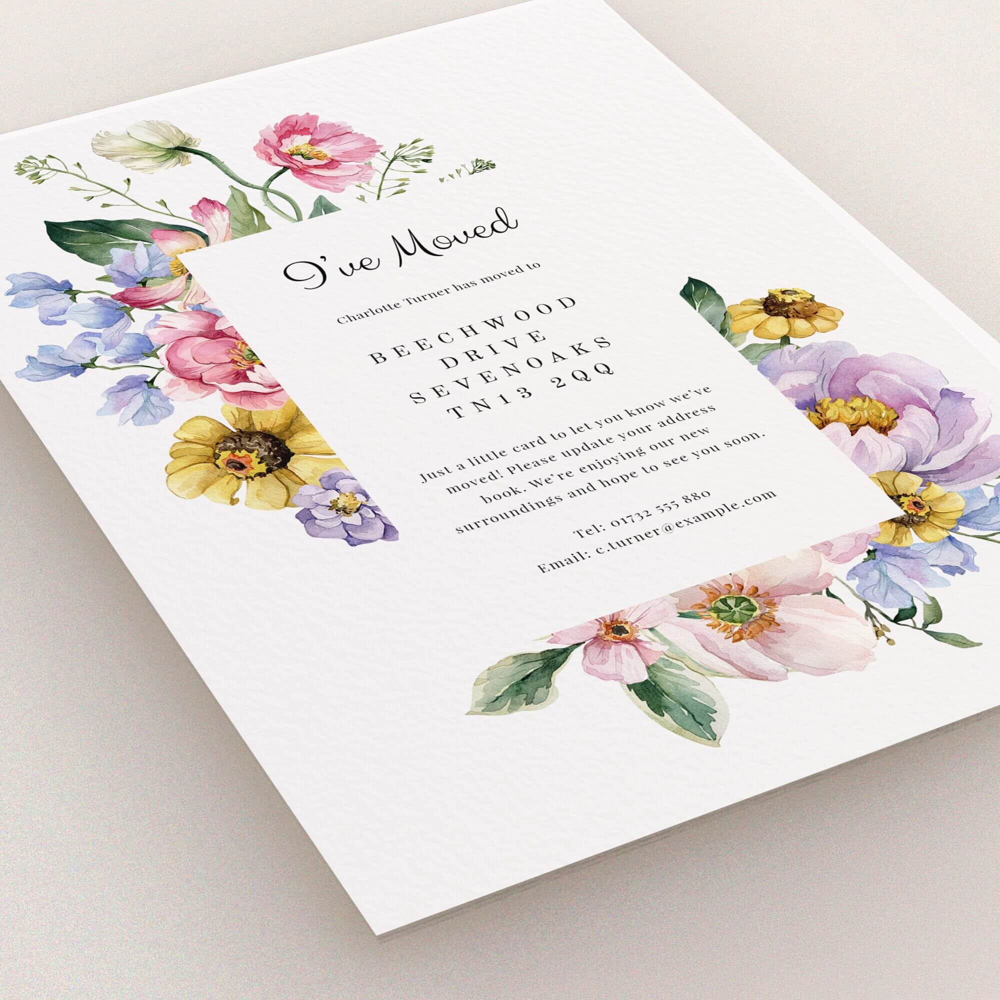 Floral change of address card design with three decorative flower illustrations.
