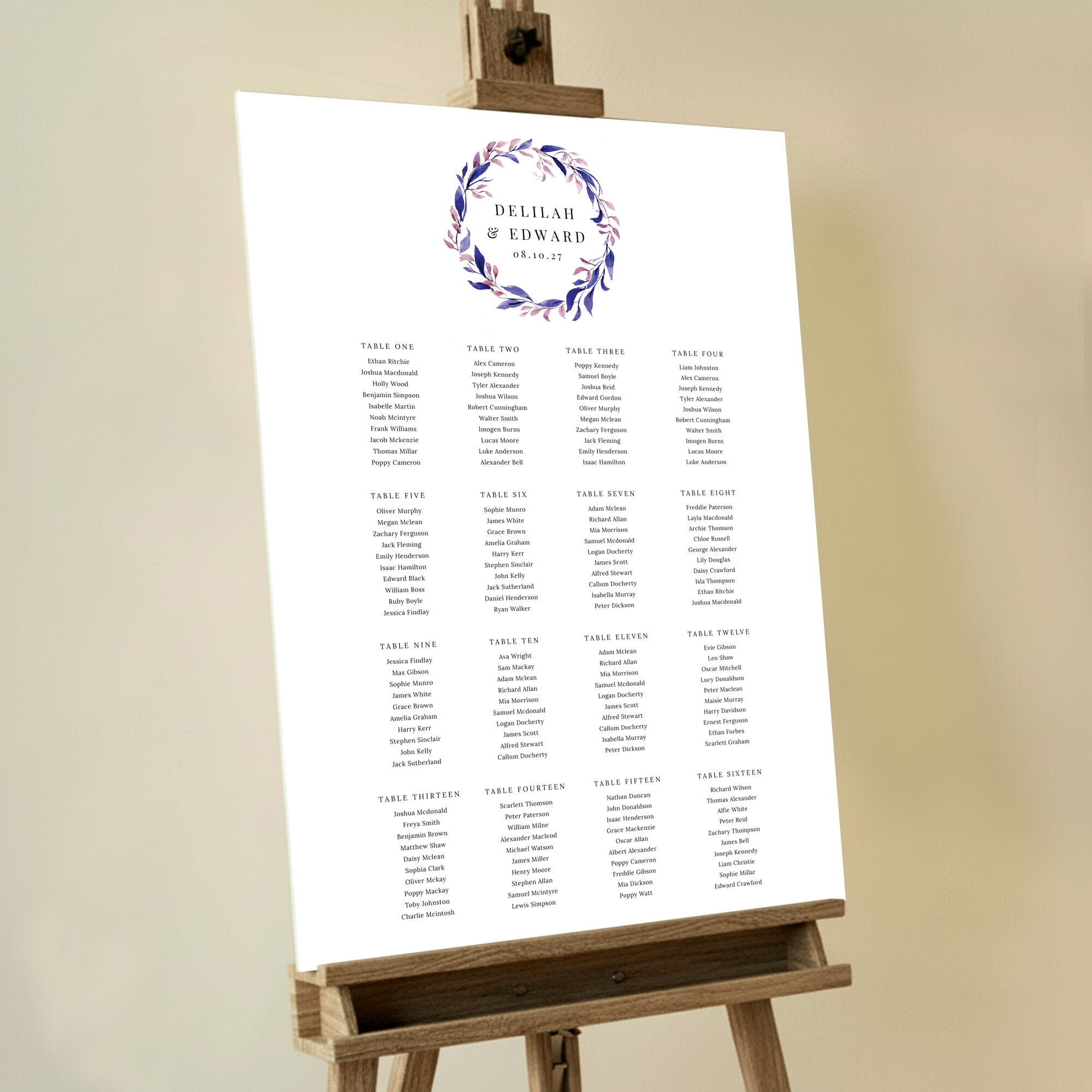 Romantic and whimsical wedding seating plan featuring a gorgeous floral wreath in shades of blue and purple surrounding the couple's names at the top of the board.. This one shows 16 tables.