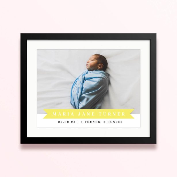 Framed and mounted photo print with a single photo of a newborn baby wrapped in a blue blanket.