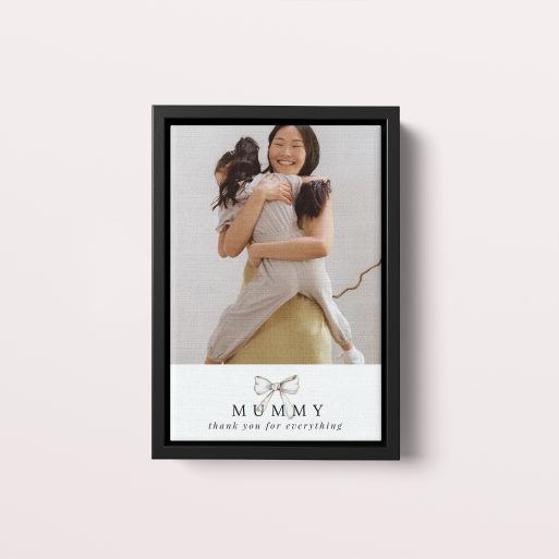 Photo of a framed photo canvase called 'Tied with a bow'. It is 30cm x 20cm in size, in a Portrait orientation. It has space for 1 photos.