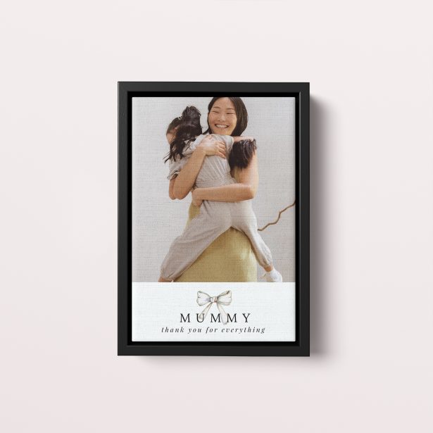 Photo of a framed photo canvase called 'Tied with a bow'. It is 30cm x 20cm in size, in a Portrait orientation. It has space for 1 photos.
