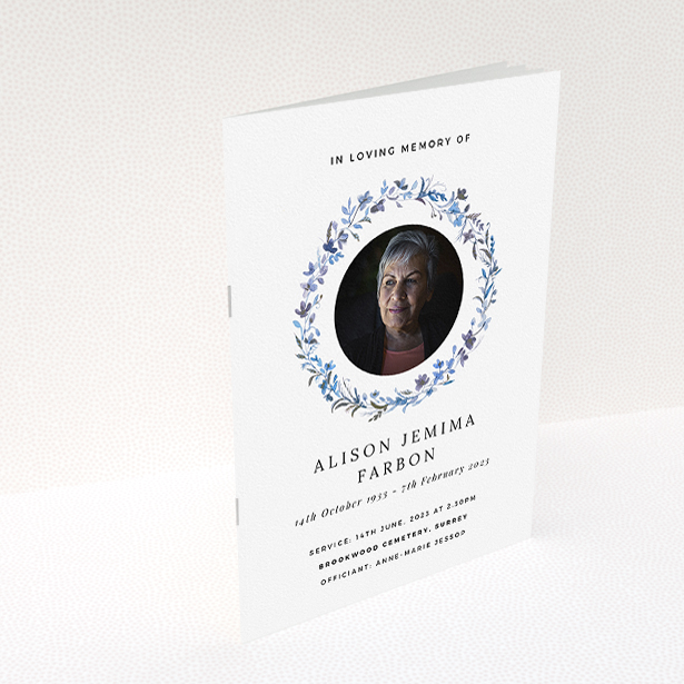 A funeral order of service named "Blue Floral. It is an A5 booklet in a portrait orientation. It is a photographic funeral program with room for 1 photo. "Blue Floral" is available as a folded booklet booklet, with tones of blue, light blue and purple.