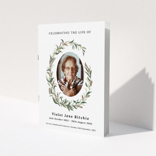 A funeral order of service named 'elegant wreath. It is an A5 booklet in a portrait orientation. It is a photographic funeral order of service with room for 1 photo. 'elegant wreath' is available as a folded booklet booklet, with tones of white and green.