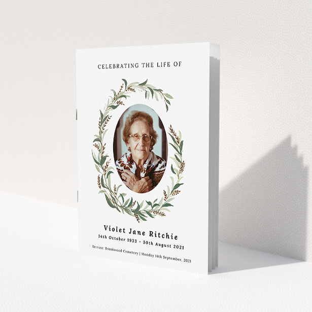 A funeral order of service named "elegant wreath. It is an A5 booklet in a portrait orientation. It is a photographic funeral order of service with room for 1 photo. "elegant wreath" is available as a folded booklet booklet, with tones of white and green.