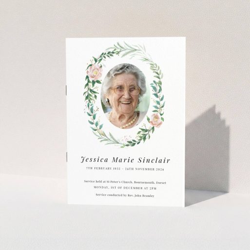 A funeral order of service named "Floral celebration. It is an A5 booklet in a portrait orientation. It is a photographic funeral program with room for 1 photo. "Floral celebration" is available as a folded booklet booklet, with tones of white, light pink and green.