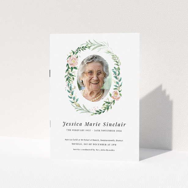A funeral order of service named "Floral celebration. It is an A5 booklet in a portrait orientation. It is a photographic funeral program with room for 1 photo. "Floral celebration" is available as a folded booklet booklet, with tones of white, light pink and green.