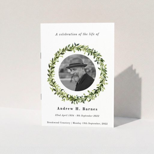 A funeral order of service named "Solemn wreath. It is an A5 booklet in a portrait orientation. It is a photographic funeral program with room for 1 photo. "Solemn wreath" is available as a folded booklet booklet, with tones of white and green.