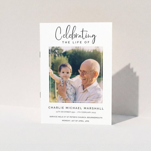 A funeral order of service named "Uplifting Remembrance. It is an A5 booklet in a portrait orientation. It is a photographic funeral order of service with room for 1 photo. "Uplifting Remembrance" is available as a folded booklet booklet, with tones of white and black.