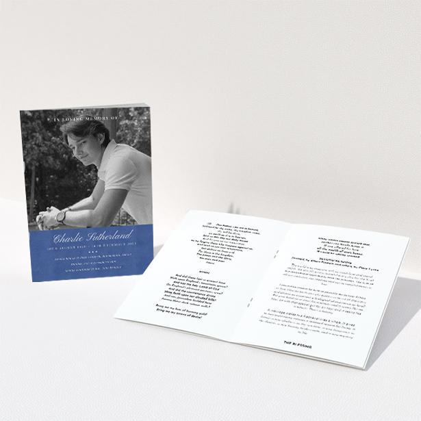 A funeral order of service named "Bold Elegance. It is an A5 booklet in a portrait orientation. It is a photographic funeral program with room for 1 photo. "Bold Elegance" is available as a folded booklet booklet, with splashes of navy blue.