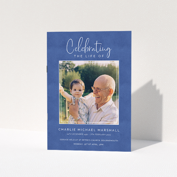 A funeral order of service named "Uplifting Remembrance. It is an A5 booklet in a portrait orientation. It is a photographic funeral order of service with room for 1 photo. "Uplifting Remembrance" is available as a folded booklet booklet, with splashes of navy blue.