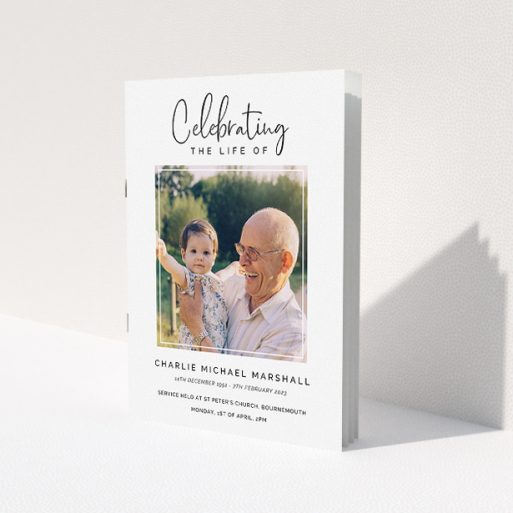 A funeral order of service named 'Uplifting Remembrance. It is an A5 booklet in a portrait orientation. It is a photographic funeral order of service with room for 1 photo. 'Uplifting Remembrance' is available as a folded booklet booklet, with tones of white and black.