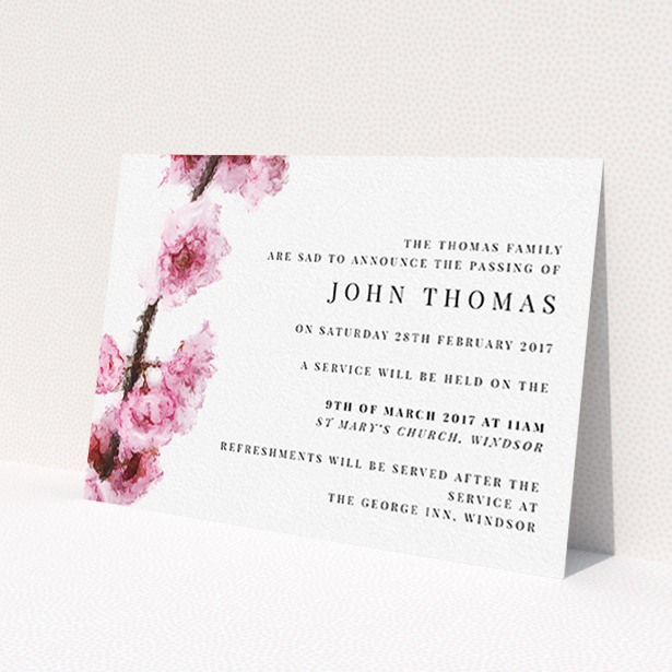 A funeral announcement card named 'Blossom at an angle'. It is an A6 card in a landscape orientation. 'Blossom at an angle' is available as a flat card, with tones of pink and white.