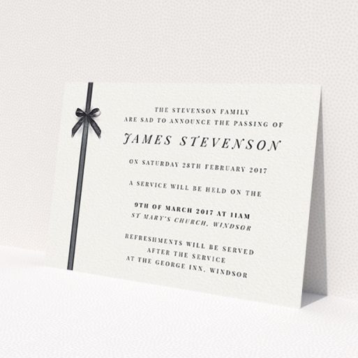 A funeral announcement card named 'Gracefully tied'. It is an A6 card in a landscape orientation. 'Gracefully tied' is available as a flat card, with tones of pale cream and faded black.