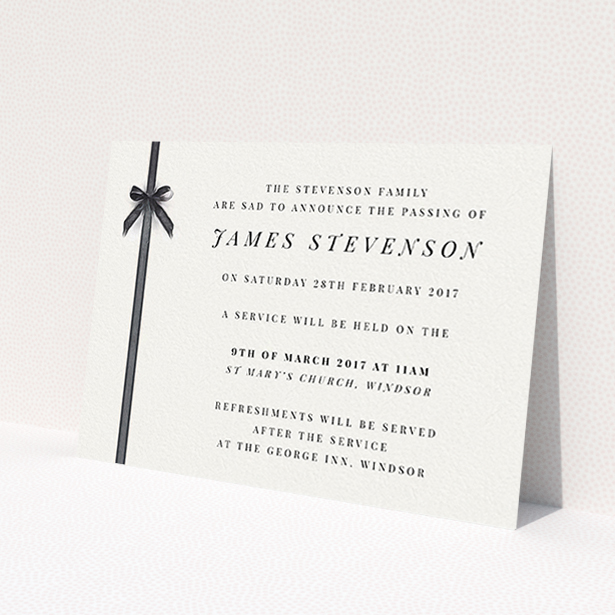 A funeral announcement card named "Gracefully tied". It is an A6 card in a landscape orientation. "Gracefully tied" is available as a flat card, with tones of pale cream and faded black.