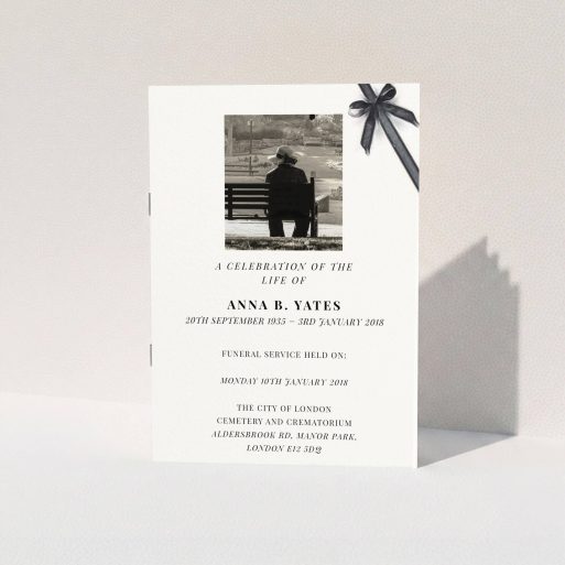 A funeral ceremony program template titled "Peacefully tied". It is an A5 booklet in a portrait orientation. It is a photographic funeral ceremony program with room for 1 photo. "Peacefully tied" is available as a folded booklet booklet, with tones of pale cream and faded black.