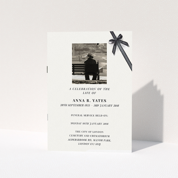 A funeral ceremony program template titled "Peacefully tied". It is an A5 booklet in a portrait orientation. It is a photographic funeral ceremony program with room for 1 photo. "Peacefully tied" is available as a folded booklet booklet, with tones of pale cream and faded black.