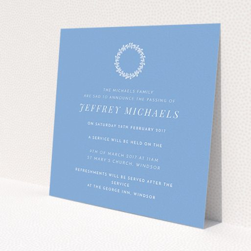 A funeral invite named 'White flower circle'. It is a square (148mm x 148mm) invite in a square orientation. 'White flower circle' is available as a flat invite, with tones of blue and white.