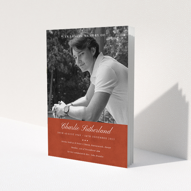 A funeral order of service named 'Bold Elegance. It is an A5 booklet in a portrait orientation. It is a photographic funeral program with room for 1 photo. 'Bold Elegance' is available as a folded booklet booklet, with splashes of red.