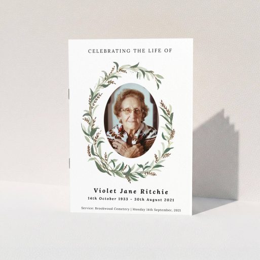 Funeral Order of Service Design - "elegant wreath" A funeral order of service named "elegant wreath. It is an A5 booklet in a portrait orientation. It is a photographic funeral order of service with room for 1 photo. "elegant wreath" is available as a folded booklet booklet, with tones of white and green.