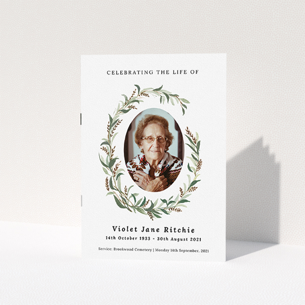 A funeral order of service named "elegant wreath. It is an A5 booklet in a portrait orientation. It is a photographic funeral order of service with room for 1 photo. "elegant wreath" is available as a folded booklet booklet, with tones of white and green.