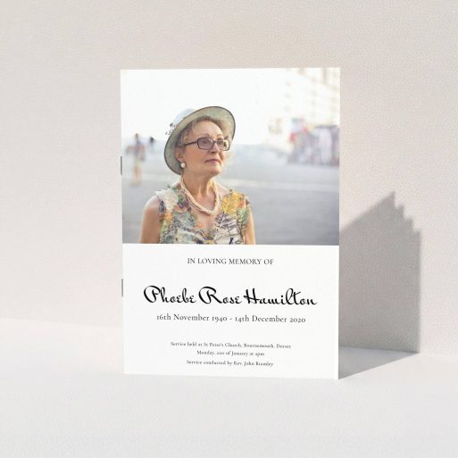 A funeral order of service named "Simple Elegance. It is an A5 booklet in a portrait orientation. It is a photographic funeral order of service with room for 1 photo. "Simple Elegance" is available as a folded booklet booklet, with tones of white and black.