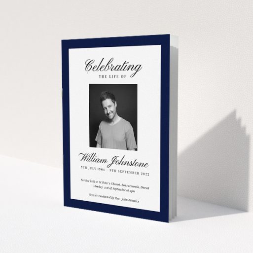 A funeral order of service named 'Stoic Border. It is an A5 booklet in a portrait orientation. It is a photographic funeral order of service with room for 1 photo. 'Stoic Border' is available as a folded booklet booklet, with tones of white and navy blue.
