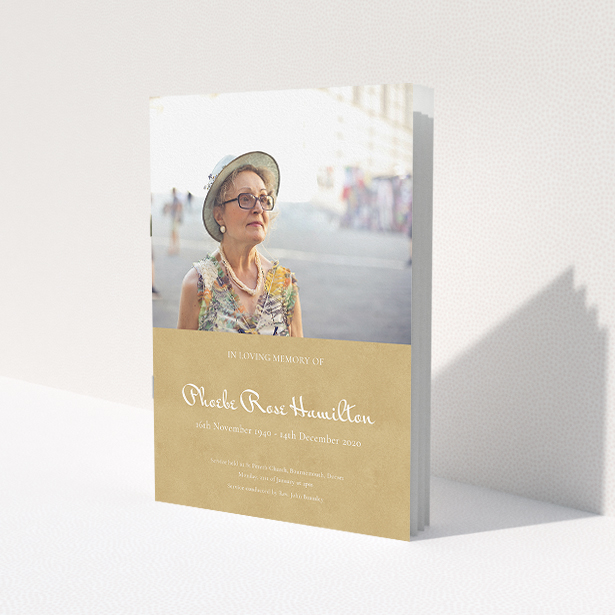 A funeral order of service named 'Simple Elegance. It is an A5 booklet in a portrait orientation. It is a photographic funeral order of service with room for 1 photo. 'Simple Elegance' is available as a folded booklet booklet, with tones of orange and gold.