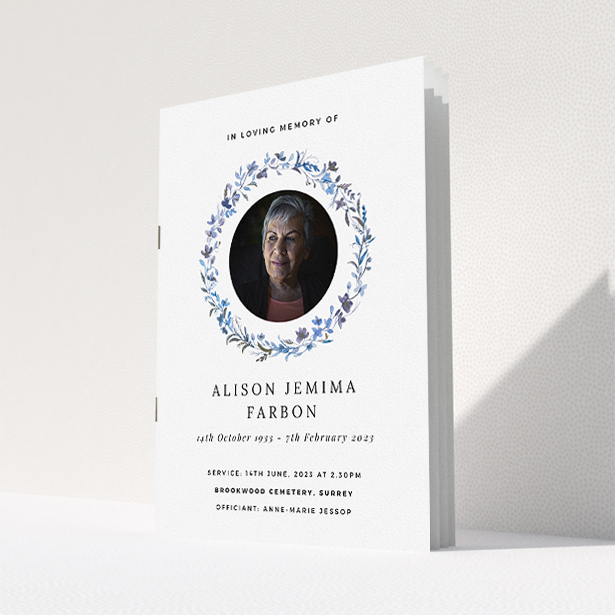 A funeral order of service named "Blue Floral. It is an A5 booklet in a portrait orientation. It is a photographic funeral program with room for 1 photo. "Blue Floral" is available as a folded booklet booklet, with tones of blue, light blue and purple.