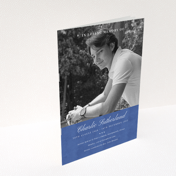 A funeral order of service named "Bold Elegance. It is an A5 booklet in a portrait orientation. It is a photographic funeral program with room for 1 photo. "Bold Elegance" is available as a folded booklet booklet, with splashes of navy blue.