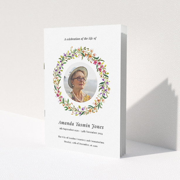 A funeral order of service named 'Bright Florals. It is an A5 booklet in a portrait orientation. It is a photographic funeral program with room for 1 photo. 'Bright Florals' is available as a folded booklet booklet, with tones of yellow, light pink and orange.