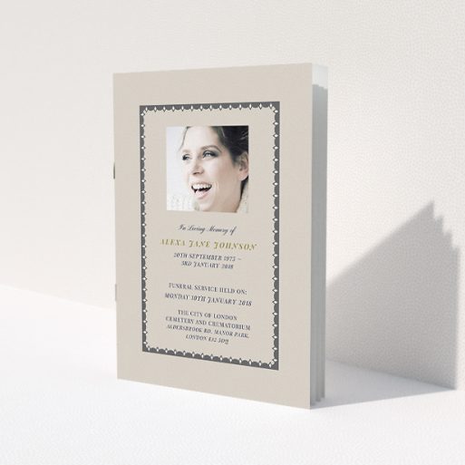 A funeral service program design named 'Along the tower grade'. It is an A5 booklet in a portrait orientation. It is a photographic funeral service program with room for 1 photo. 'Along the tower grade' is available as a folded booklet booklet, with tones of dark cream and dark grey.
