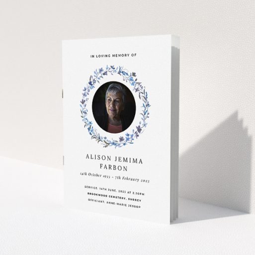 A funeral order of service named 'Blue Floral. It is an A5 booklet in a portrait orientation. It is a photographic funeral program with room for 1 photo. 'Blue Floral' is available as a folded booklet booklet, with tones of blue, light blue and purple.