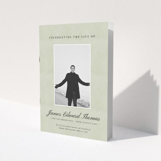 A funeral order of service named 'Hazy background. It is an A5 booklet in a portrait orientation. It is a photographic funeral program with room for 1 photo. 'Hazy background' is available as a folded booklet booklet, with splashes of green.