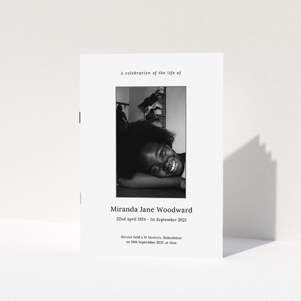A funeral order of service named "Simple Silver. It is an A5 booklet in a portrait orientation. It is a photographic funeral program with room for 1 photo. "Simple Silver" is available as a folded booklet booklet, with tones of white, grey and black.