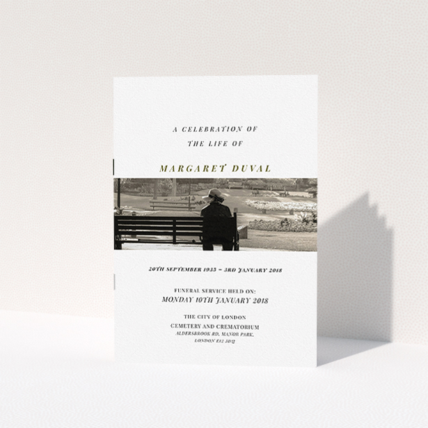 A funeral service program design titled "To the horizon". It is an A5 booklet in a portrait orientation. It is a photographic funeral service program with room for 1 photo. "To the horizon" is available as a folded booklet booklet, with tones of white and Dark gold.