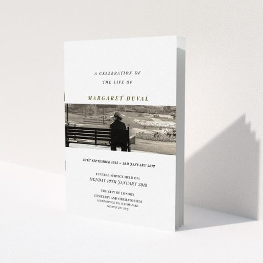 A funeral service program design titled 'To the horizon'. It is an A5 booklet in a portrait orientation. It is a photographic funeral service program with room for 1 photo. 'To the horizon' is available as a folded booklet booklet, with tones of white and Dark gold.